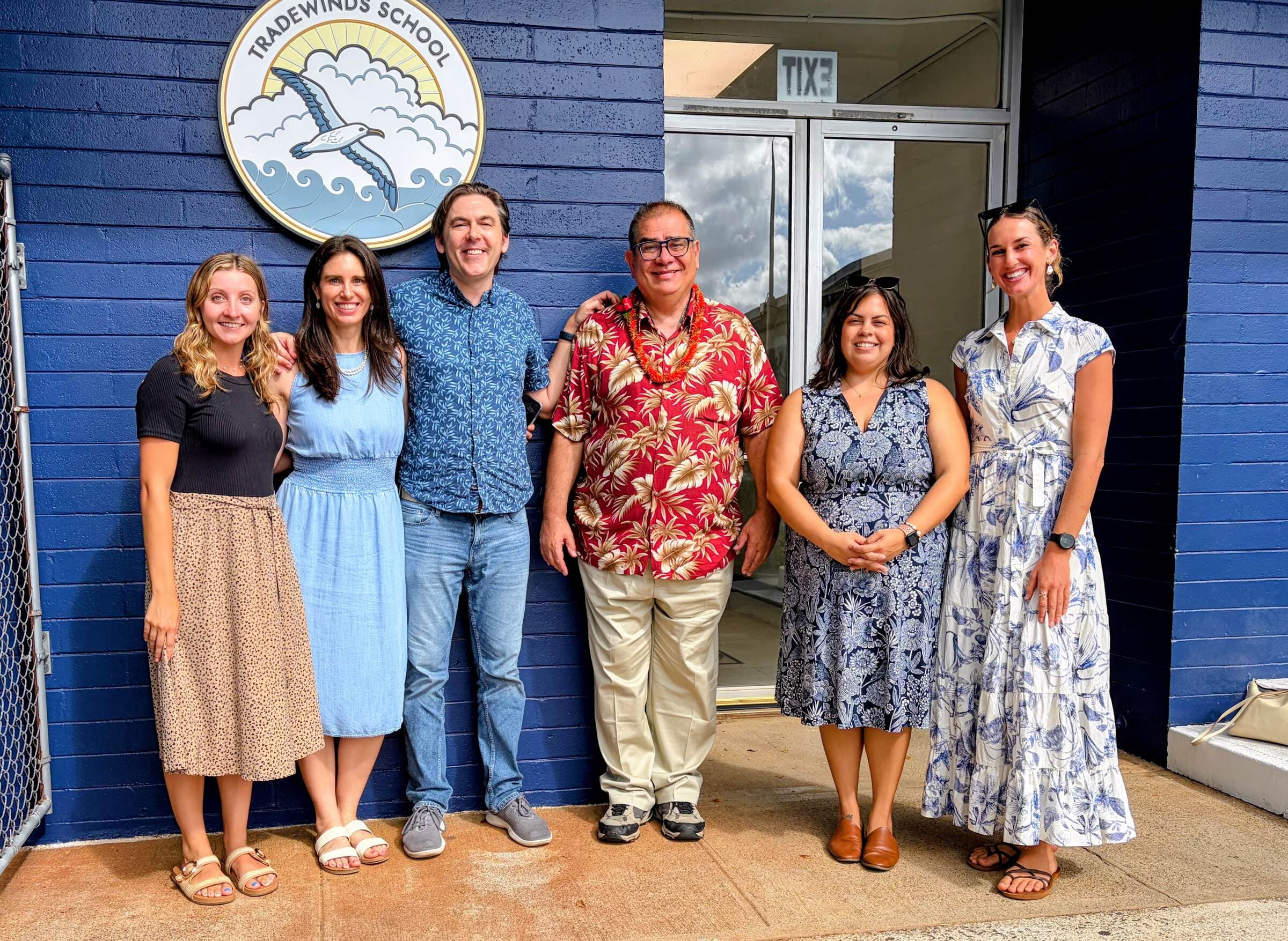 The Tradewinds School team outside the school entrance in Kaimukī